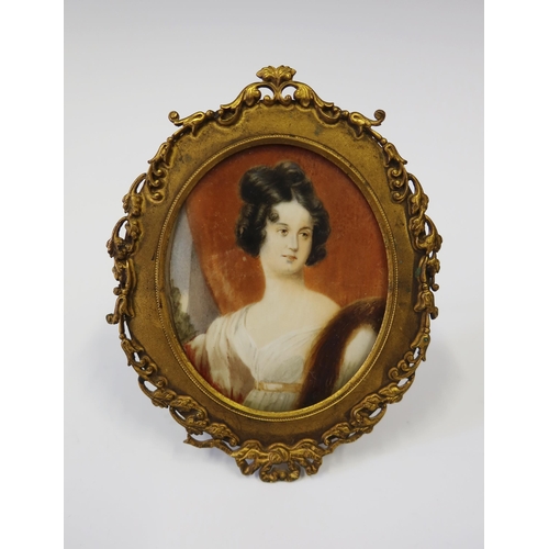 238 - An Early 19th Century Portrait Miniature of a Lady in an easel back gilt metal frame, 12 x 9.5 cm