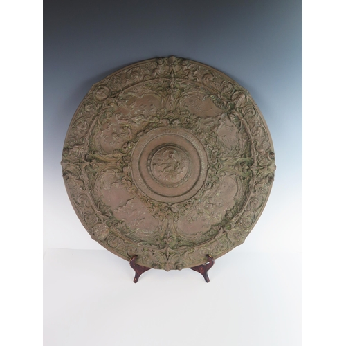 245 - Alexandre Gueyton, A 19th Century Embossed Copper Salver, 48cm diam.