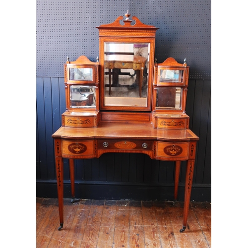 252 - An Edward & Roberts Satinwood and Mahogany Shape Front Dressing Table with foliate marquetry inlay, ... 