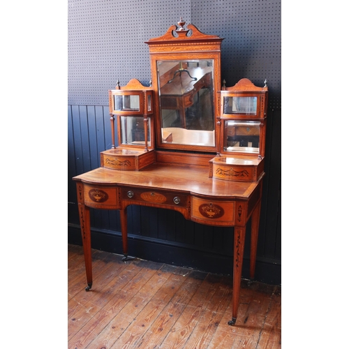 252 - An Edward & Roberts Satinwood and Mahogany Shape Front Dressing Table with foliate marquetry inlay, ... 