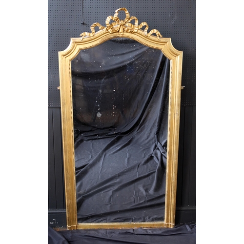 273 - A Late Victorian Gilt Mirror with a moulded frame and ribbon cresting 77in. (196cm.) high, 40in. (10... 