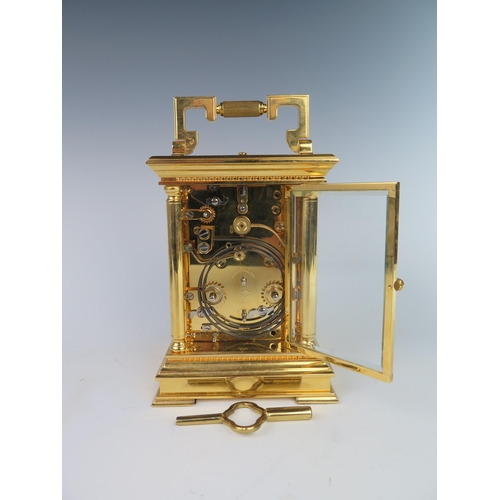 277 - A Modern L'Epée Gilt Brass Repeating Carriage Clock with calendar and alarm with bevelled glass pane... 