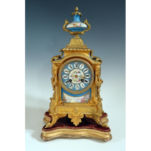 282 - A 19th Century French Gilt Metal Mantle Clock with Sevres Panels and on a gilt wood base, striking m... 