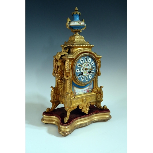 282 - A 19th Century French Gilt Metal Mantle Clock with Sevres Panels and on a gilt wood base, striking m... 