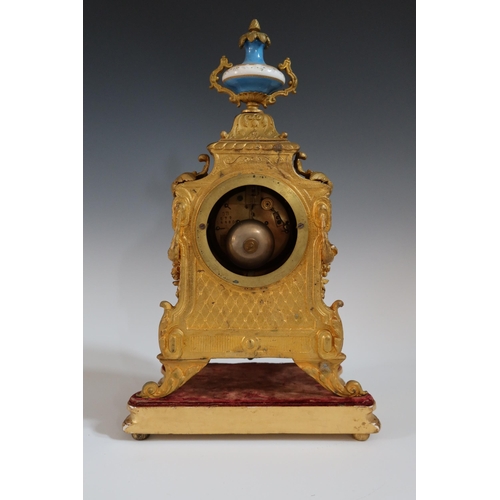 282 - A 19th Century French Gilt Metal Mantle Clock with Sevres Panels and on a gilt wood base, striking m... 