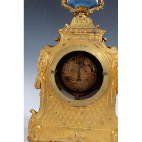 282 - A 19th Century French Gilt Metal Mantle Clock with Sevres Panels and on a gilt wood base, striking m... 