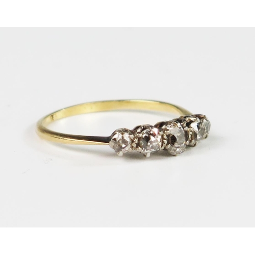 301 - An 18ct Gold and Five Stone Old Cut Diamond Ring, size R.5, 2.3g. Head of ring 17mm, largest stone 4... 