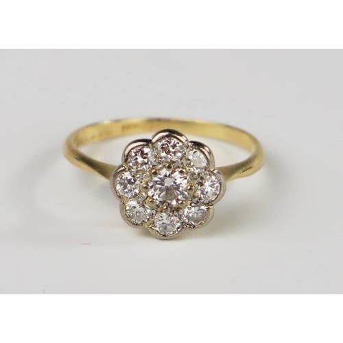 301C - An 18ct Yellow Gold and Diamond Nine Stone Flower Head Cluster Ring, 10.5mm diam. head, size M, 2.3g... 