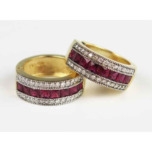 303D - A Pair of 14K Yellow Gold, Channel Set Ruby and Diamond Hoop Earrings, 21.5 mm outer diameter, 18 mm... 