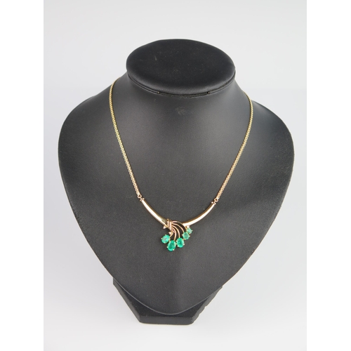 304B - An 18K Yellow Gold, Emerald and Diamond 16