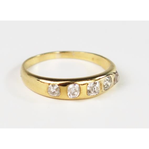 305 - An Unmarked 18ct Yellow Gold and Old Cut Diamond Five Stone Ring in a rub over setting, size Q, 3.5g... 