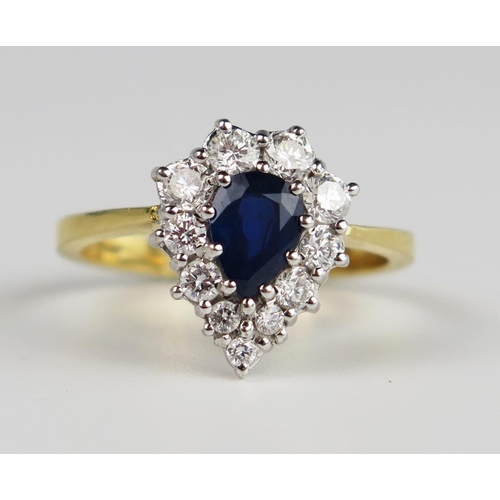 305a - An 18ct Yellow Gold, Sapphire and Diamond Pear Shaped Ring, the 7 x 5 mm pear cut sapphire surrounde... 