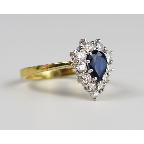 305a - An 18ct Yellow Gold, Sapphire and Diamond Pear Shaped Ring, the 7 x 5 mm pear cut sapphire surrounde... 