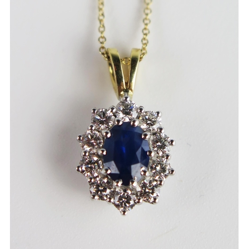 305b - A Sapphire and Diamond Oval Pendant in an unmarked gold and precious white metal setting  and on an ... 