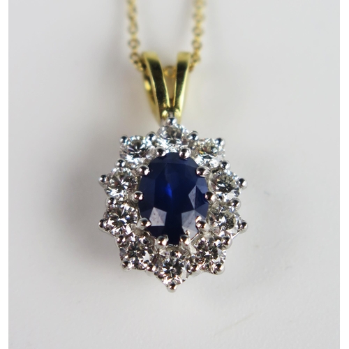 305b - A Sapphire and Diamond Oval Pendant in an unmarked gold and precious white metal setting  and on an ... 