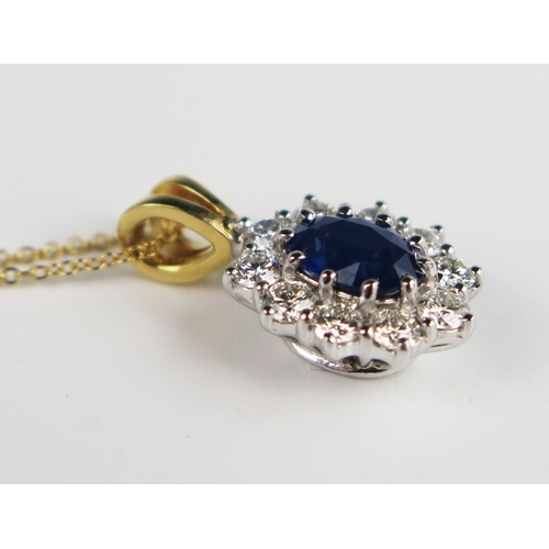 305b - A Sapphire and Diamond Oval Pendant in an unmarked gold and precious white metal setting  and on an ... 