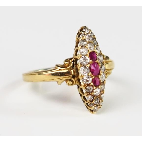 306 - An Antique 18ct Gold, Old Cut Diamond and Ruby Marquis Ring with scrolling decoration to the shoulde... 