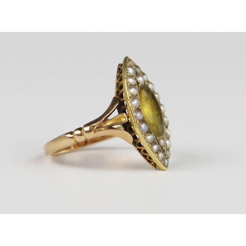 309D - An Antique Foil Backed Paste and Pearl Marquis Shaped Ring in an unmarked gold setting, 20 x 11 mm h... 