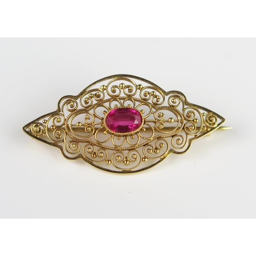 310b - An 18ct Gold and Ruby Brooch, millegrain set, stone 7.2 x 4.5 mm, 3.4 g