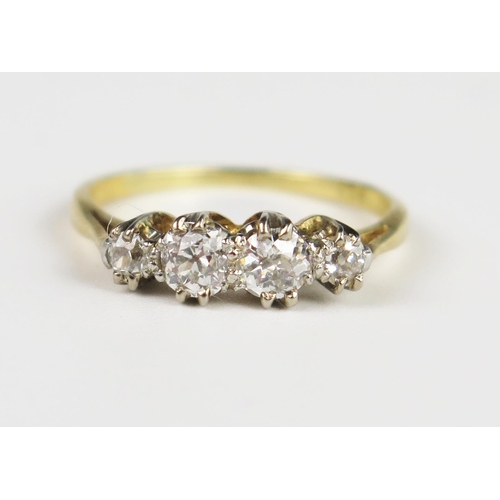 310c - An 18ct Gold and Diamond Four Stone Ring, central stones 4 mm, size L, 2.5 g