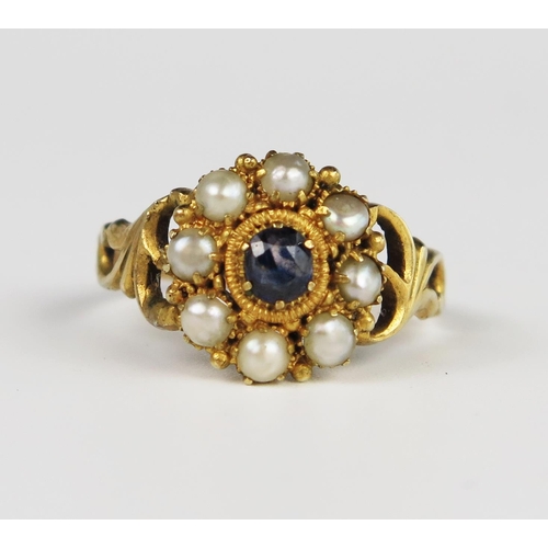 312A - A Good Georgian Amethyst and Pearl Cluster Ring in an unmarked gold setting with pierced foliate sho... 