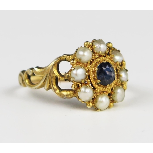 312A - A Good Georgian Amethyst and Pearl Cluster Ring in an unmarked gold setting with pierced foliate sho... 