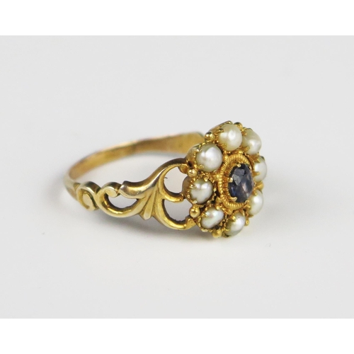 312A - A Good Georgian Amethyst and Pearl Cluster Ring in an unmarked gold setting with pierced foliate sho... 