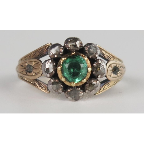 323 - A Georgian Foil Backed Green Paste and Rose Cut Diamond Cluster Ring in a rub over setting, unmarked... 