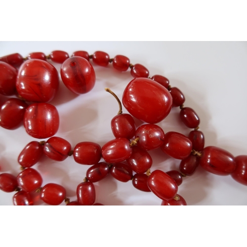 329 - A Damaged Amber Bead Necklace, largest bead 29 x 23.5mm, 118.3g