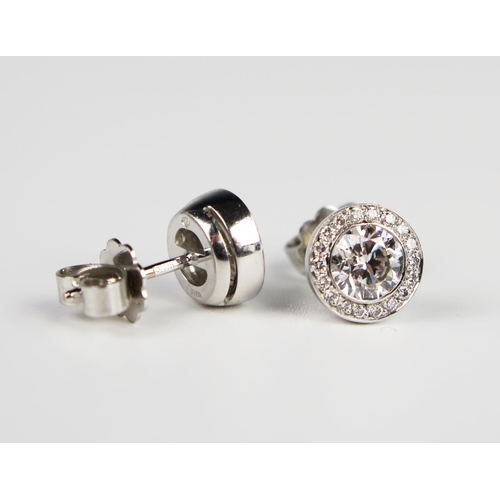 338 - A Pair of Hans D. Krieger 18ct White Gold Diamond Stud Earrings, the central brilliant round cut sto... 