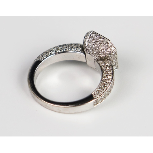 339 - A Hans D. Krieger Radiant Cut Diamond Ring in a rub over setting surrounded by brilliant cut stones ... 