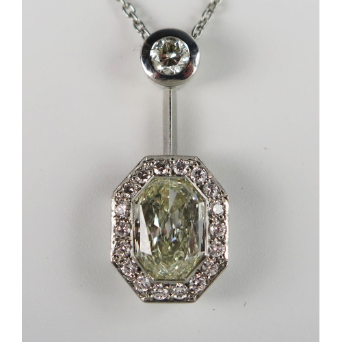 340 - A Modern Platinum and Diamond Pendant Necklace, the central octagonal multi-faceted 2.01ct stone ass... 