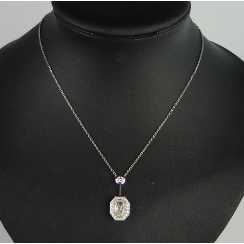 340 - A Modern Platinum and Diamond Pendant Necklace, the central octagonal multi-faceted 2.01ct stone ass... 