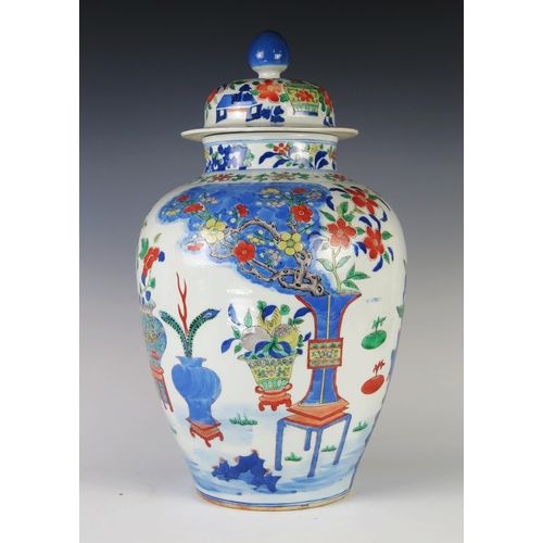 352 - An Antique Chinese Wucai Porcelain Vase with Cover decorated with vases, prunus, ferns and other fol... 