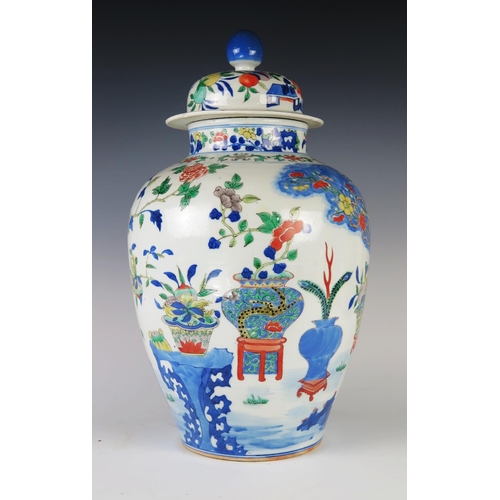 352 - An Antique Chinese Wucai Porcelain Vase with Cover decorated with vases, prunus, ferns and other fol... 