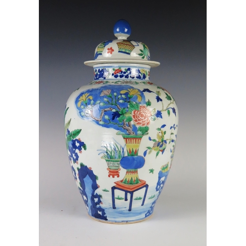 352 - An Antique Chinese Wucai Porcelain Vase with Cover decorated with vases, prunus, ferns and other fol... 