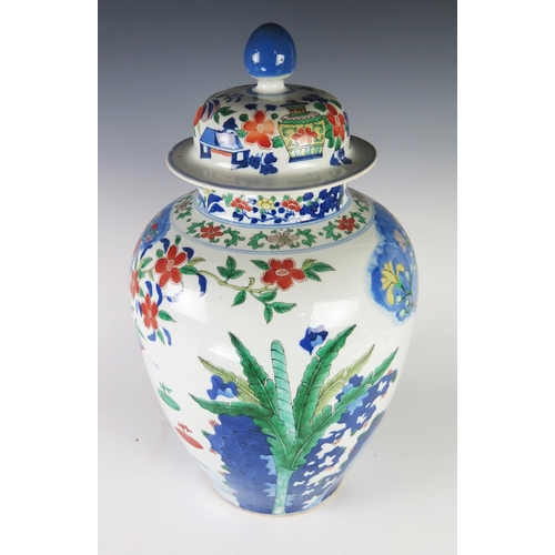 352 - An Antique Chinese Wucai Porcelain Vase with Cover decorated with vases, prunus, ferns and other fol... 