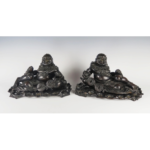 361 - A Pair of 19th Century Chinese Carved Hardwood Figures on stands, bases c. 36 cm wide, 21 cm high