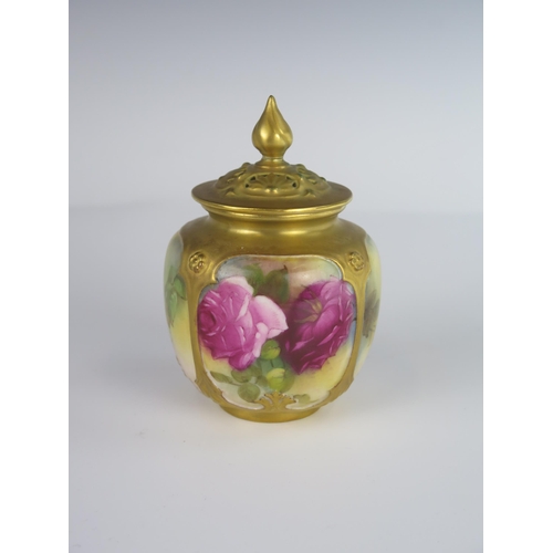 387 - A Royal Worcester Potpourri Vase with reticulated cover and decorated with roses, 1922 model 162, 12... 