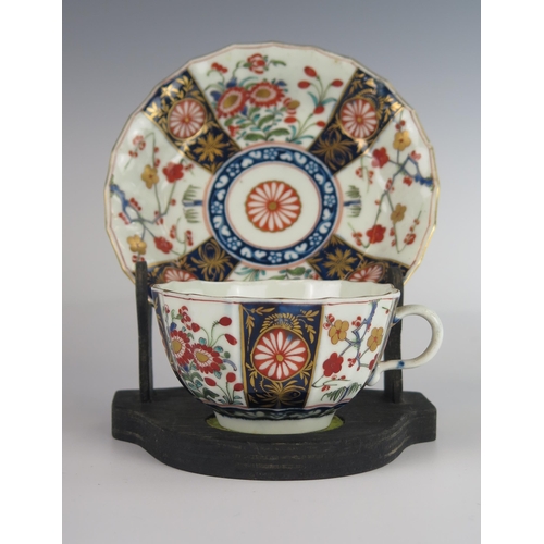 394 - An 18th Century Worcester Dr. Wall Period Shaped Teacup and Saucer decorated in the Imari palette