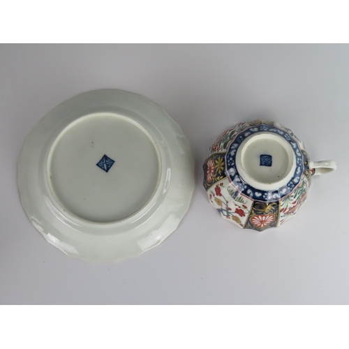 394 - An 18th Century Worcester Dr. Wall Period Shaped Teacup and Saucer decorated in the Imari palette