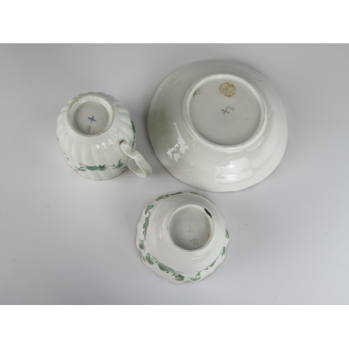 397 - An 18th Century Bristol Porcelain Tea Bowl with Saucer and a coffee can with green foliate swag deco... 