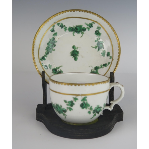 398 - An 18th Century Bristol Porcelain Teacup with Saucer decorated with green foliate swags