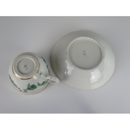 398 - An 18th Century Bristol Porcelain Teacup with Saucer decorated with green foliate swags