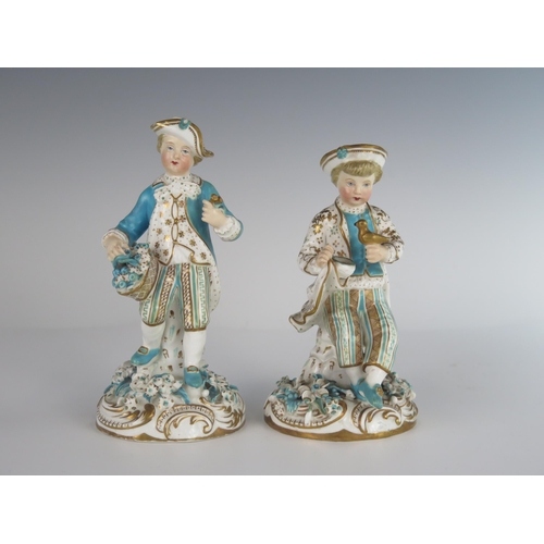 400 - A Pair of 18th Century Chelsea Derby? Porcelain Figurines, one with a bird and the other with bouque... 