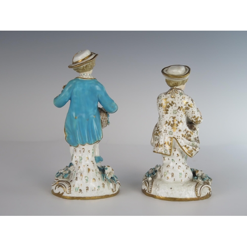 400 - A Pair of 18th Century Chelsea Derby? Porcelain Figurines, one with a bird and the other with bouque... 