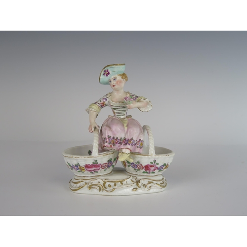 401 - An 18th Century Meissen Porcelain Figure of a Lady Seated on Two Baskets, underglaze mark to base, 1... 