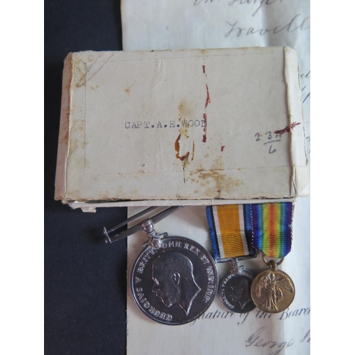 412 - A WWI Medal Pair awarded to CAPT. A.E. WOOD. with original cardboard box and dress miniatures, two p... 