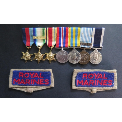 416 - A Royal Marines WWII and later Seven Medal Dress Miniature Group and pair of cloth lapel badges