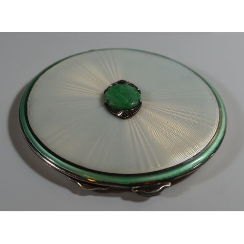 42 - An Edward VIII Silver, Opalescent and Green Guilloché Enamel Compact set with central carved jadeite... 